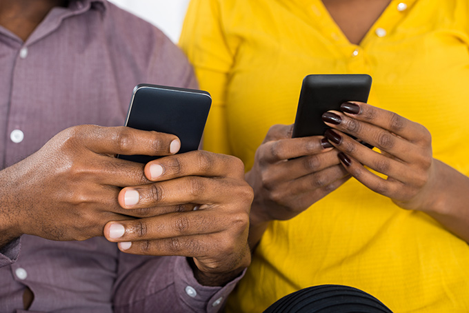 Couple Holding Smartphones
